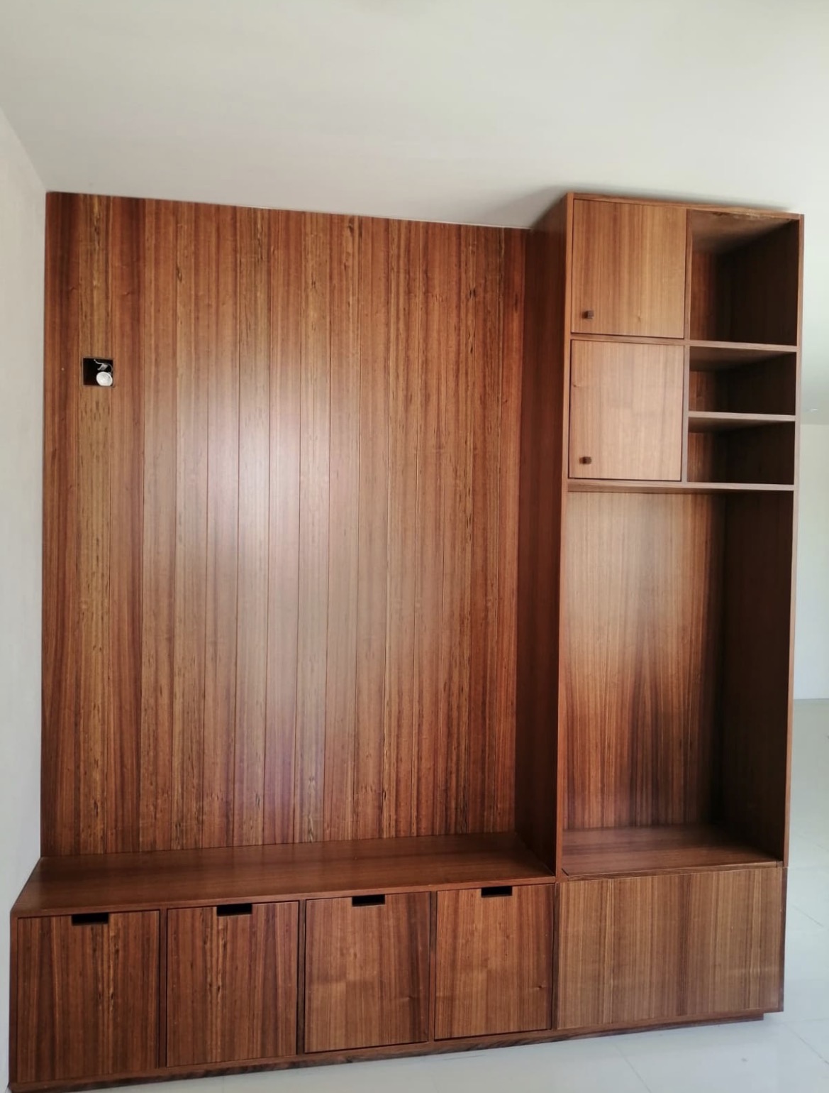 Full-wall hardwood media built-in with open shelving