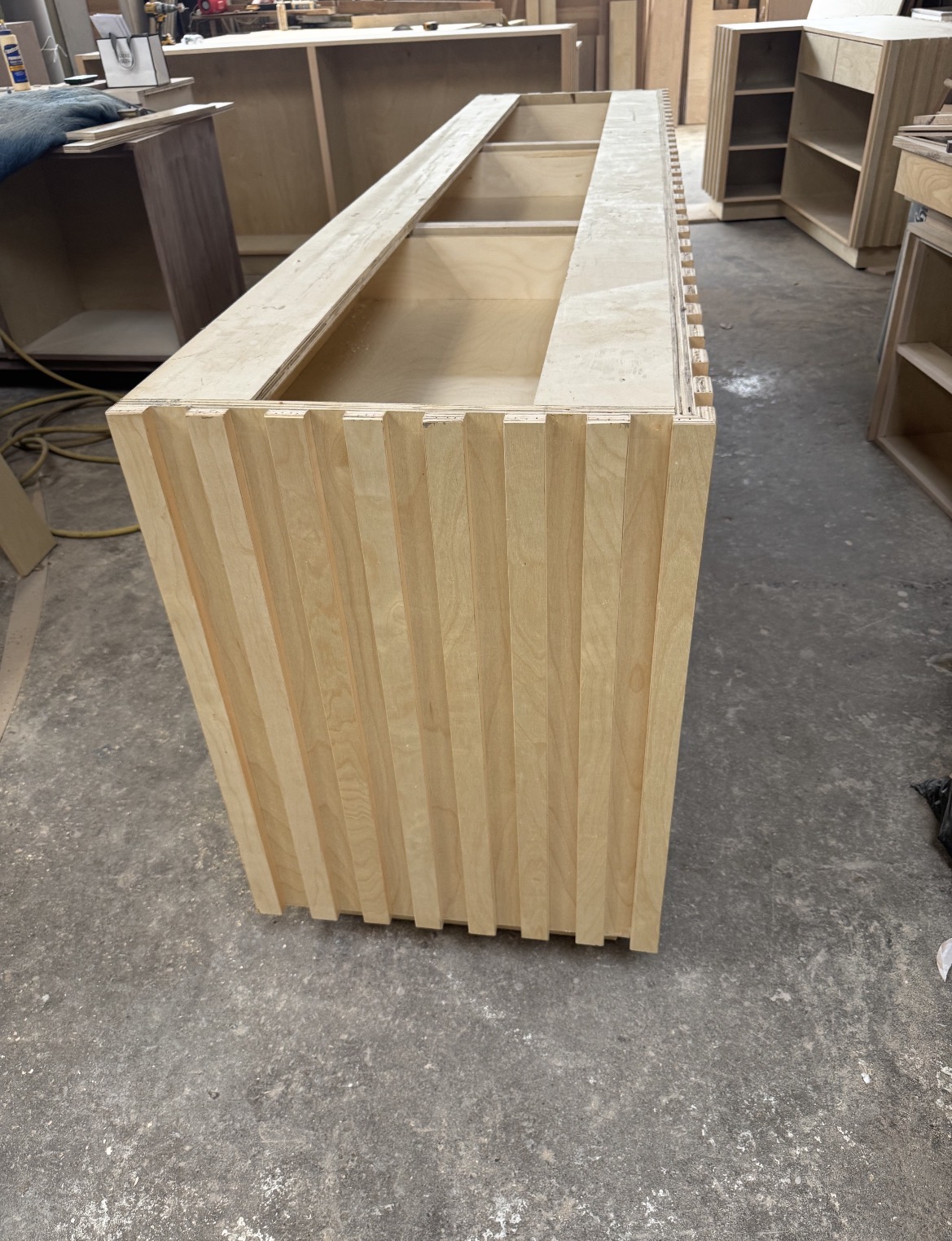 Fluted wood commercial display counter built in our shop